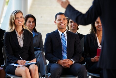 Diverse group of business professionals engaged in an etiquette training session